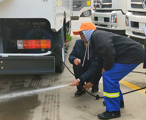 Customer from South Africa come to factory and learn how to use sweeper truck