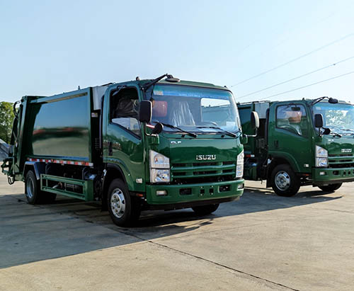 Two Units Of ISUZU Compactor Garbage Trucks Ship To Guam